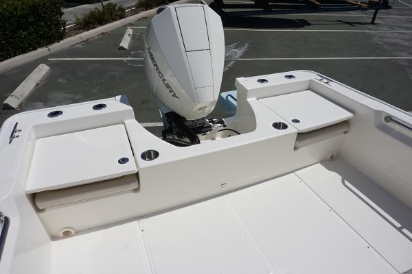 Slide: The Image of 2024 Boston Whaler 210 Montauk boat stern with Mercury outboard engine. - 14
