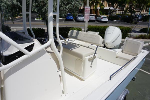 Slide: The Image of 2024 Boston Whaler 210 Montauk boat interior with seating and console. - 6