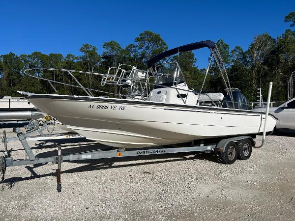 Slide: The Image of 2007 Boston Whaler 220 Dauntless boat on trailer, parked outdoors. - 0