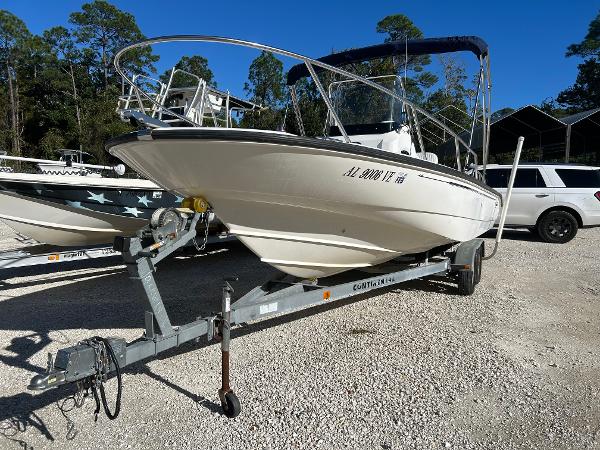 Slide: The Image of 2007 Boston Whaler 220 Dauntless boat on trailer in sunny outdoor setting. - 1