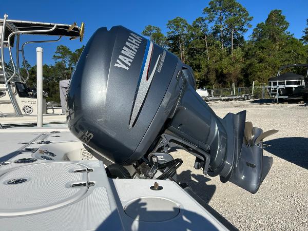 Slide: The Image of 2007 Boston Whaler 220 Dauntless with Yamaha outboard motor in a sunny outdoor setting. - 10
