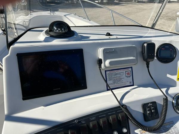 Slide: The Image of Dashboard of 2007 Boston Whaler 220 Dauntless with navigation equipment and controls. - 19