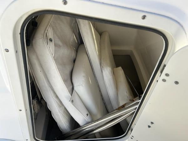 Slide: The Image of Storage compartment with cushions in a 2007 Boston Whaler 220 Dauntless boat. - 21