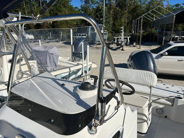 Slide: The Image of 2007 Boston Whaler 220 Dauntless boat interior with steering wheel and seating. - 22