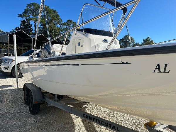 Slide: The Image of 2007 Boston Whaler 220 Dauntless boat on trailer, parked outdoors. - 3