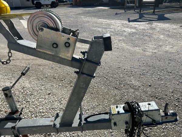 Slide: The Image of Boat trailer for 2007 Boston Whaler 220 Dauntless in a parking lot. - 5