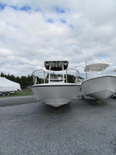 Slide: The Image of 2019 Boston Whaler 240 Dauntless boat on display outdoors. - 1