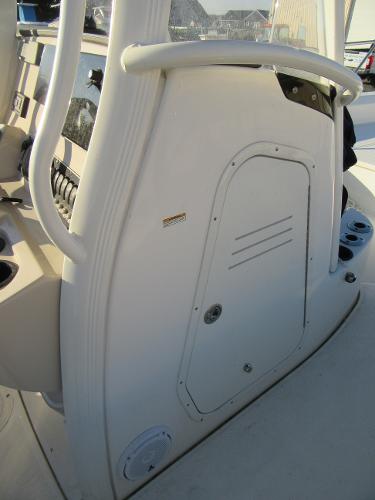 Slide: The Image of 2019 Boston Whaler 240 Dauntless console storage compartment. - 16