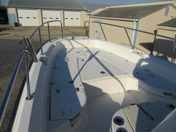 Slide: The Image of 2019 Boston Whaler 240 Dauntless boat deck with storage compartments and railings. - 3