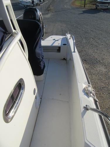 Slide: The Image of 2019 Boston Whaler 240 Dauntless boat deck with seating and storage compartments. - 6