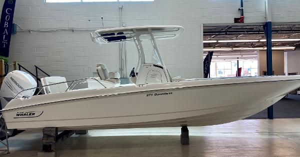 Slide: The Image of 2021 Boston Whaler 270 Dauntless boat displayed indoors, side view. - 0