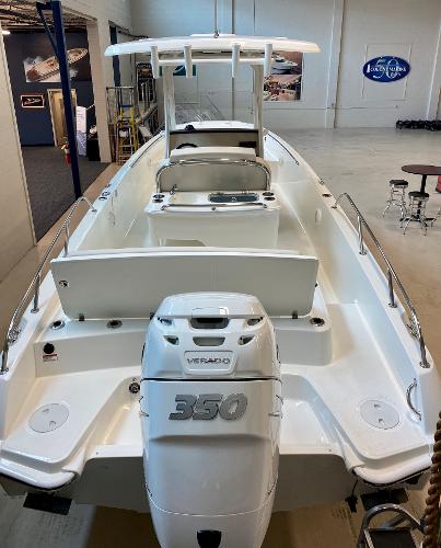 Slide: The Image of 2021 Boston Whaler 270 Dauntless boat with powerful 350 engine in showroom. - 2