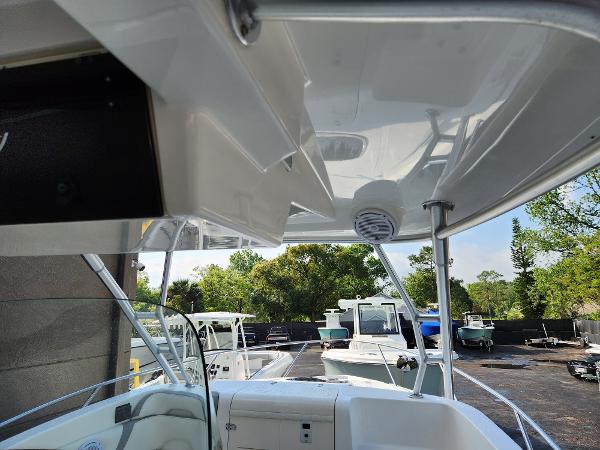 Slide: The Image of 2008 Boston Whaler 320 Outrage Cuddy Cabin, view from cockpit, parked with other boats. - 17