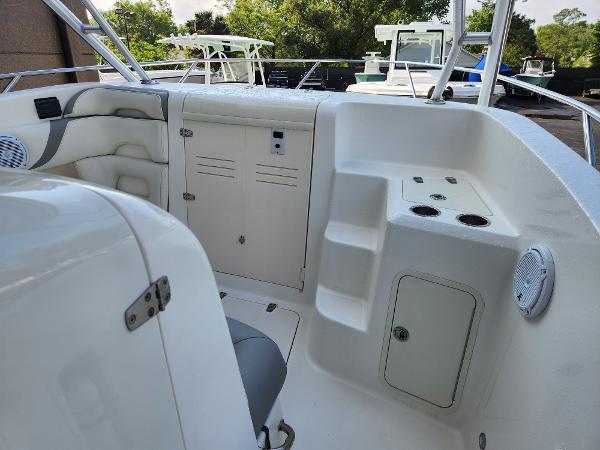 Slide: The Image of 2008 Boston Whaler 320 Outrage Cuddy Cabin interior with seating and storage compartments. - 18