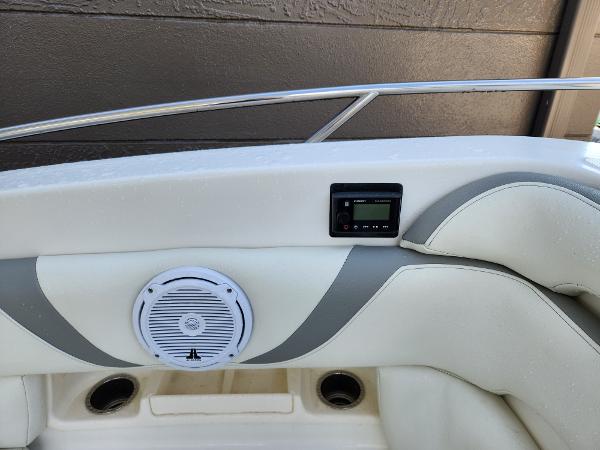Slide: The Image of 2008 Boston Whaler 320 Outrage Cuddy Cabin interior with speaker and control panel. - 24