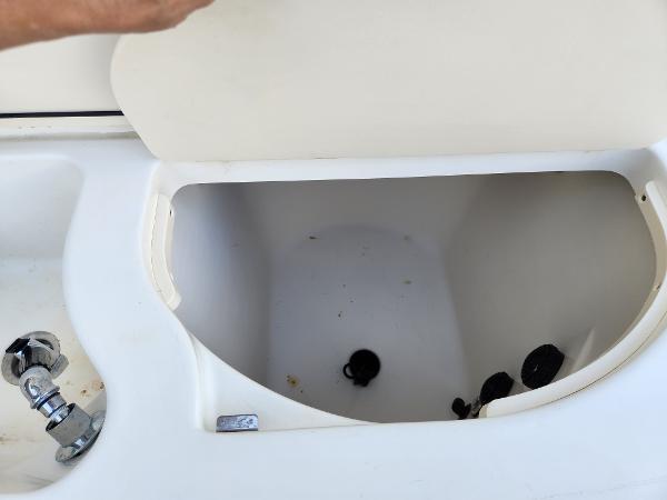 Slide: The Image of Open storage compartment on 2008 Boston Whaler 320 Outrage Cuddy Cabin boat. - 34