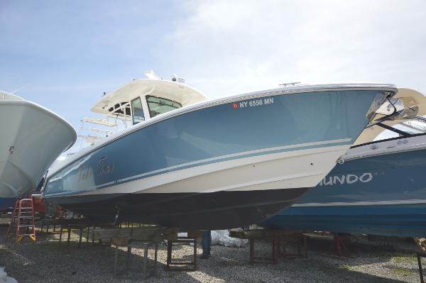 Slide: The Image of 2018 Boston Whaler 330 Outrage boat on display, side view. - 0