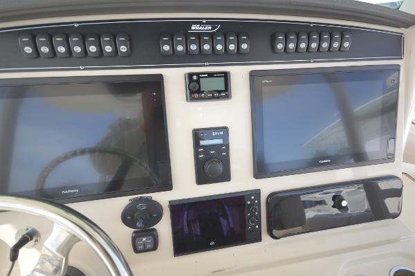 Slide: The Image of Control panel of a 2018 Boston Whaler 330 Outrage boat with Garmin displays. - 15