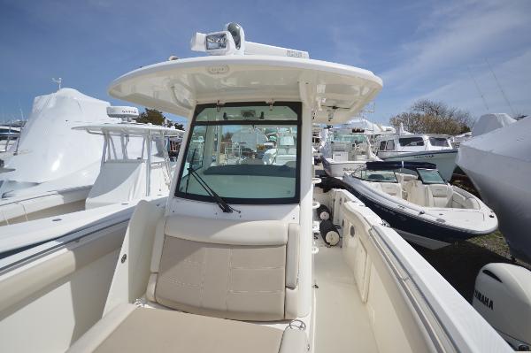 Slide: The Image of 2018 Boston Whaler 330 Outrage boat with center console and seating. - 9