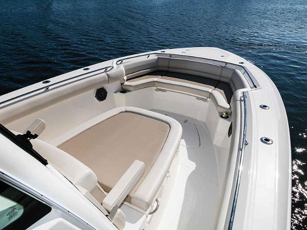 Slide: The Image of 2024 Boston Whaler 330 Outrage boat interior with cushioned seating. - 39