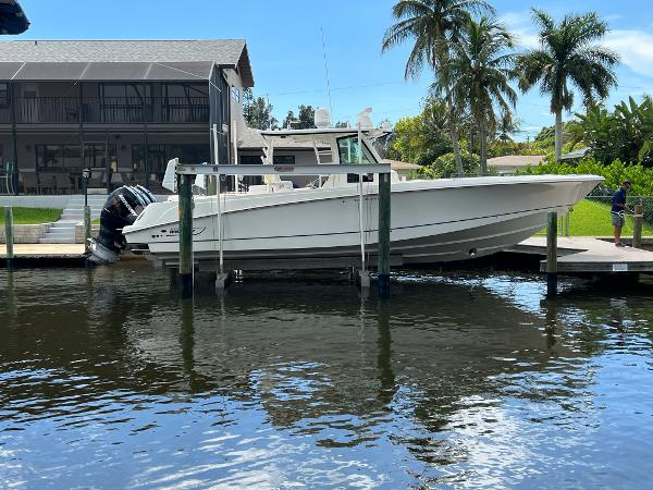 Slide: The Image of 2013 Boston Whaler 370 Outrage docked near waterfront home. - 0