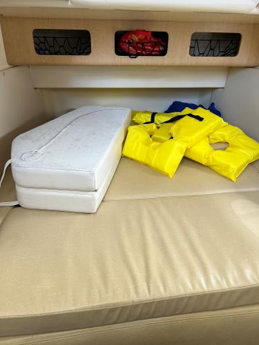 Slide: The Image of Interior cabin of a 2013 Boston Whaler 370 Outrage with life jackets. - 21