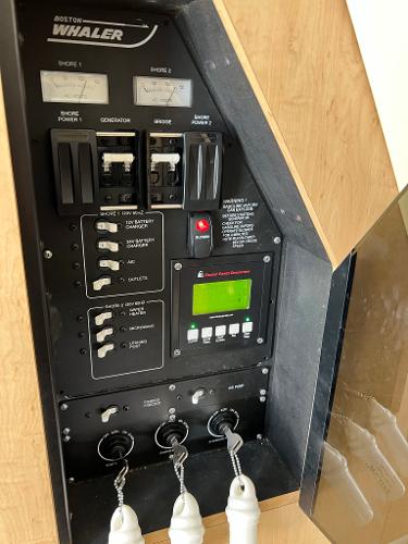 Slide: The Image of Control panel of a 2013 Boston Whaler 370 Outrage boat. - 26