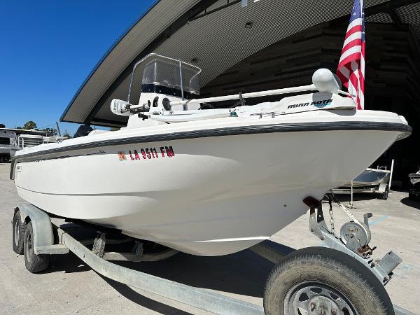 Slide: The Image of 2000 Boston Whaler Outrage 18 boat on trailer with American flag. - 6