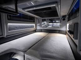 Slide: The Image of 2023 BRABUS Shadow 500 Cabin interior, featuring modern design and ambient lighting. - 23