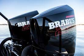 Slide: The Image of 2023 BRABUS Shadow 500 outboard motors on water, sleek black design. - 3