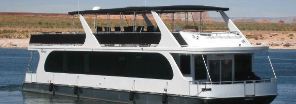 Slide: The Image of 2011 Bravada Dream Weaver Trip 15 houseboat on a lake. - 1