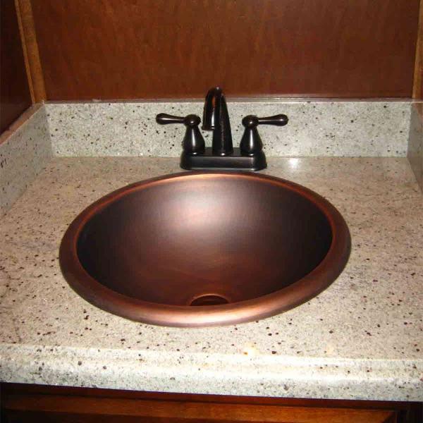 Slide: The Image of Copper sink with black faucet on granite countertop in Bravada Dream Weaver Trip 15, 2011 model. - 10
