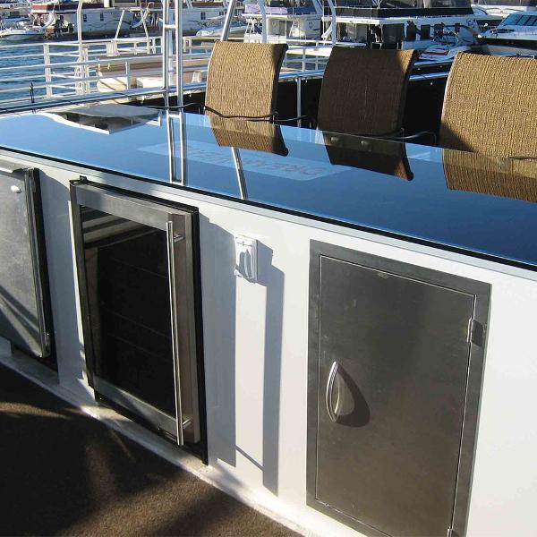 Slide: The Image of Outdoor kitchen area on a 2011 Bravada Dream Weaver Trip 15 houseboat. - 13
