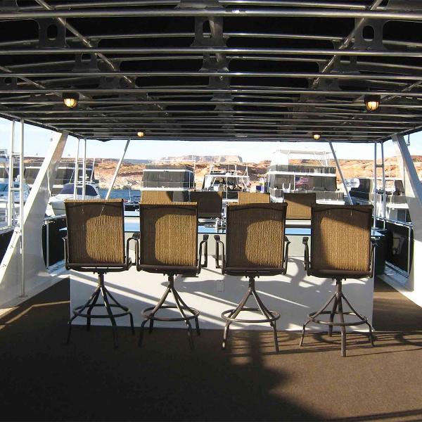 Slide: The Image of Interior of 2011 Bravada Dream Weaver Trip 15 houseboat with bar stools. - 14