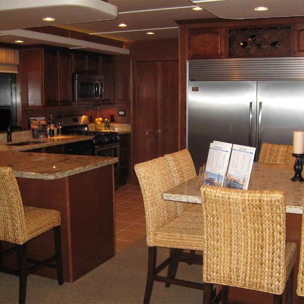 Slide: The Image of Modern kitchen in 2011 Bravada Dream Weaver Trip 15 houseboat with stainless steel appliances. - 3