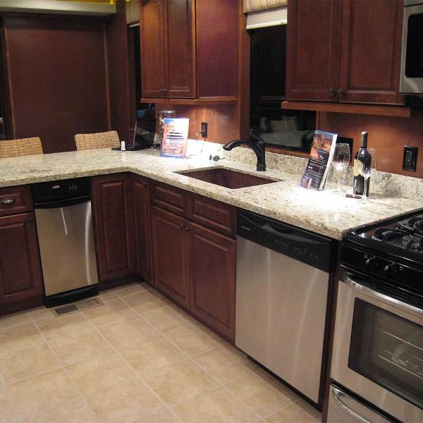Slide: The Image of Modern kitchen in 2011 Bravada Dream Weaver Trip 15 RV with granite countertops. - 4