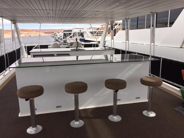 Slide: The Image of Outdoor bar area on 2012 Bravada Ho'okipa Trip 13 houseboat with stools and glass countertop. - 13