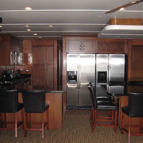 Slide: The Image of Luxurious kitchen interior of 2010 Bravada Houseboat Dream Catcher, featuring modern appliances and seating. - 2