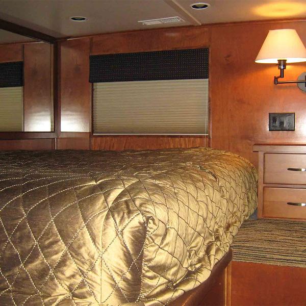 Slide: The Image of Luxurious bedroom interior of 2010 Bravada Houseboat Dream Catcher, featuring elegant bedding and warm lighting. - 6