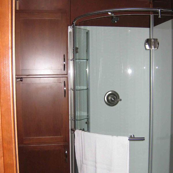 Slide: The Image of Modern bathroom with glass shower and wooden cabinets on Bravada Houseboat Dream Catcher, 2010 model. - 8