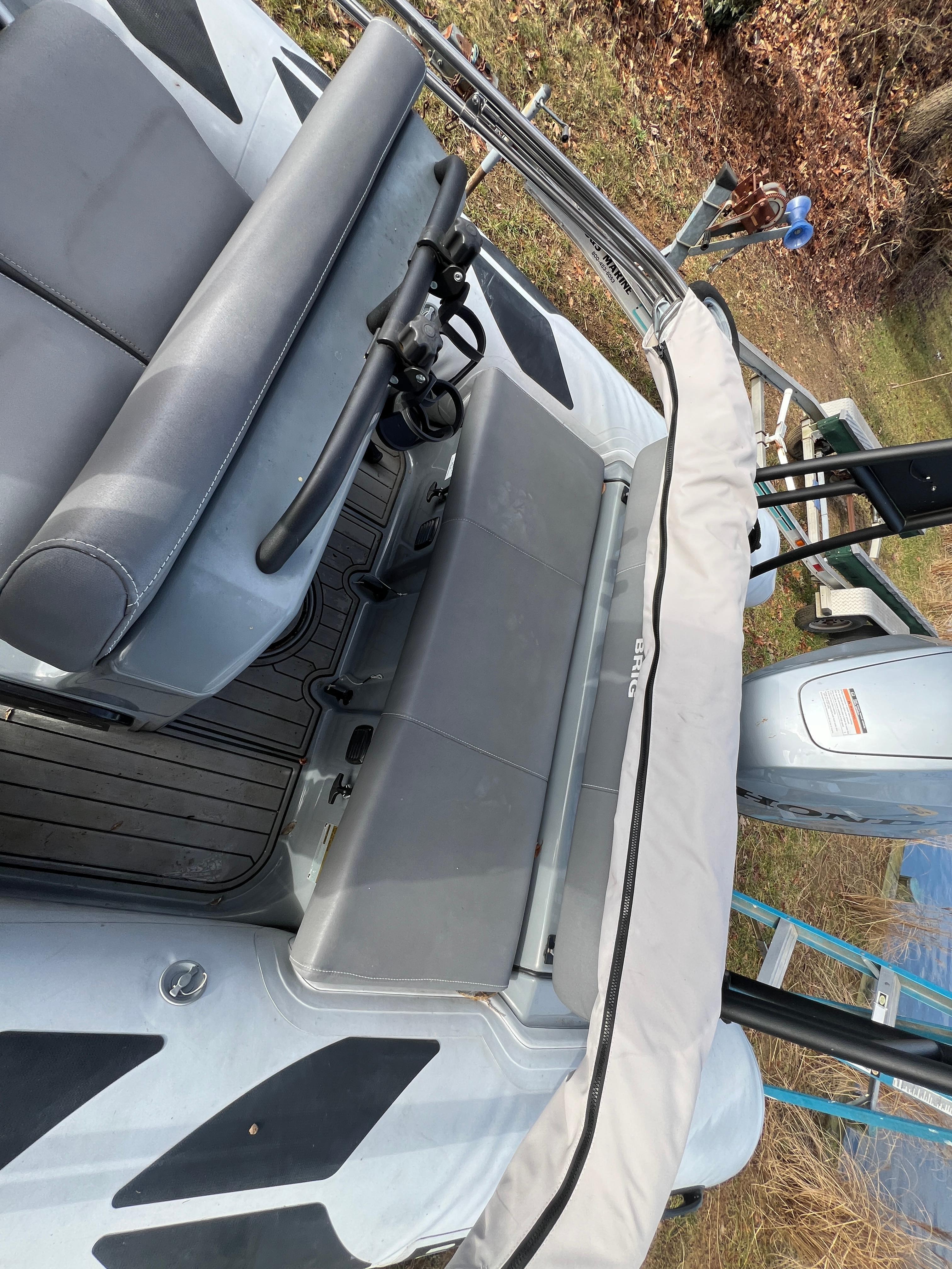 Slide: The Image of 2021 Brig Inflatables Navigator 520 boat interior with seating and steering wheel. - 11