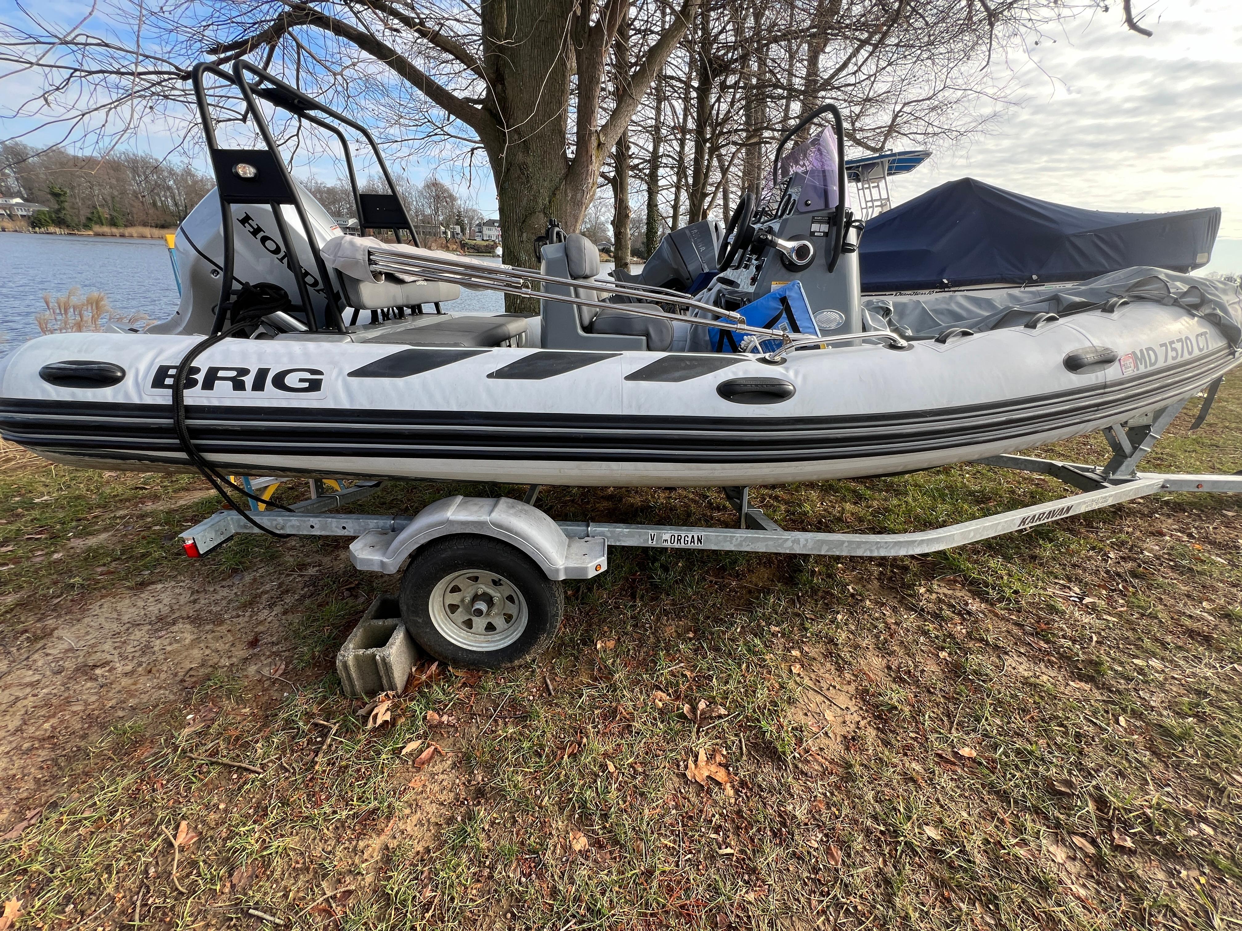 Slide: The Image of 2021 Brig Inflatables Navigator 520 on a trailer by a lakeside. - 14
