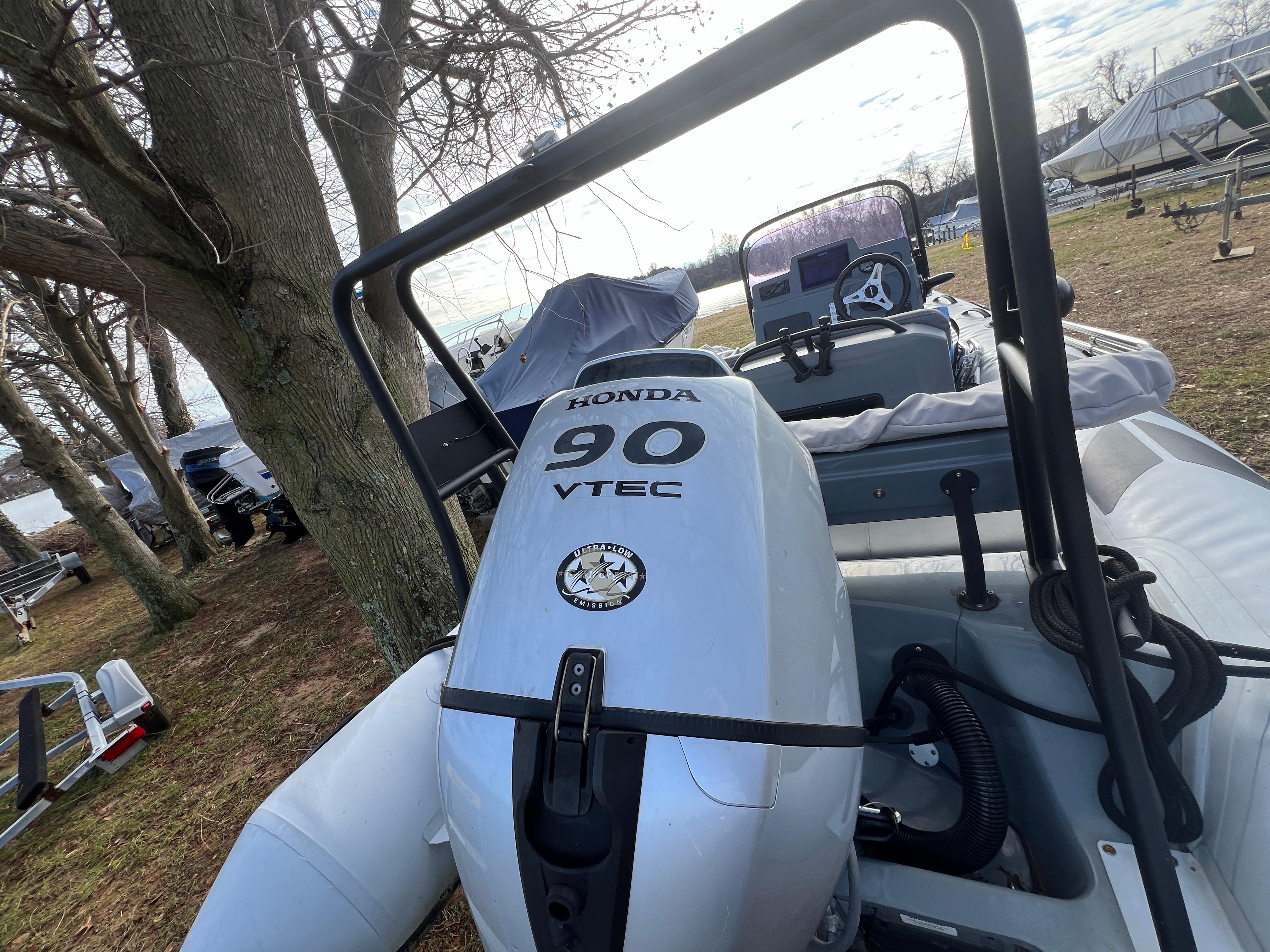 Slide: The Image of 2021 Brig Inflatables Navigator 520 with Honda 90 VTEC engine in a wooded area. - 16