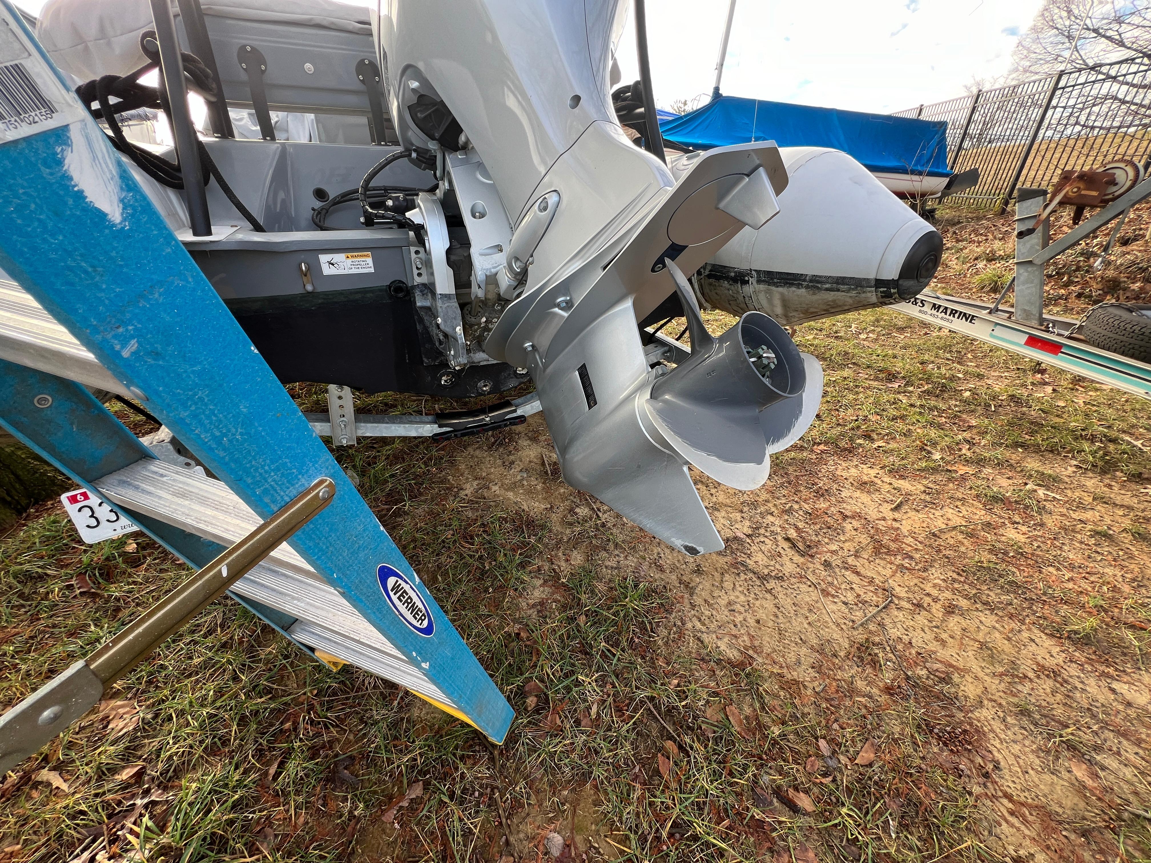 Slide: The Image of Close-up of a 2021 Brig Inflatables Navigator 520 boat motor and propeller. - 18