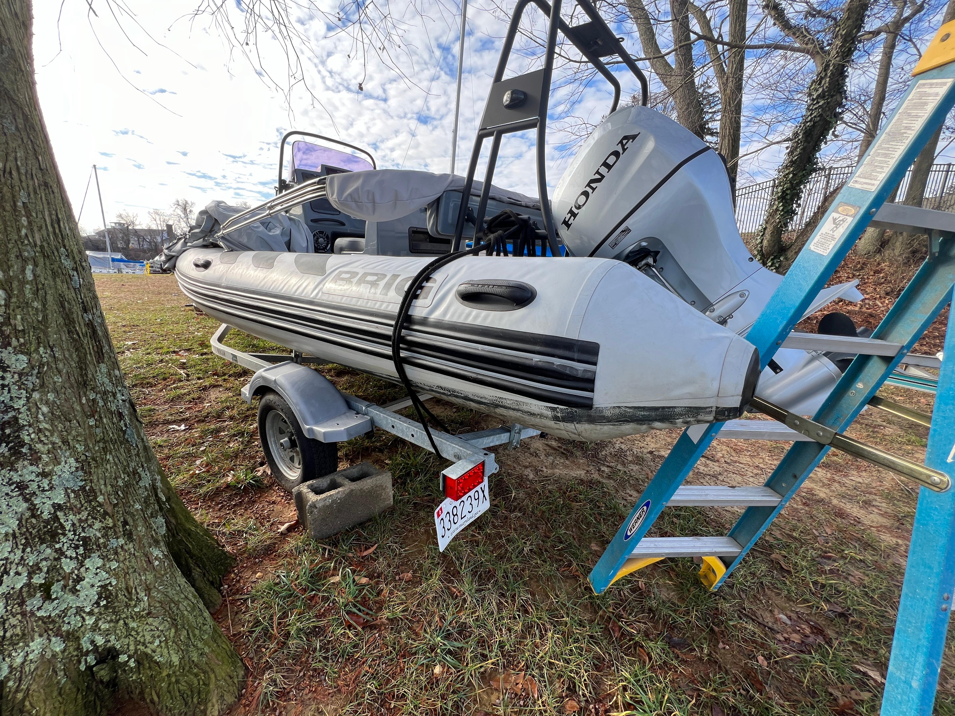 Slide: The Image of 2021 Brig Inflatables Navigator 520 boat on trailer with Honda outboard motor. - 19