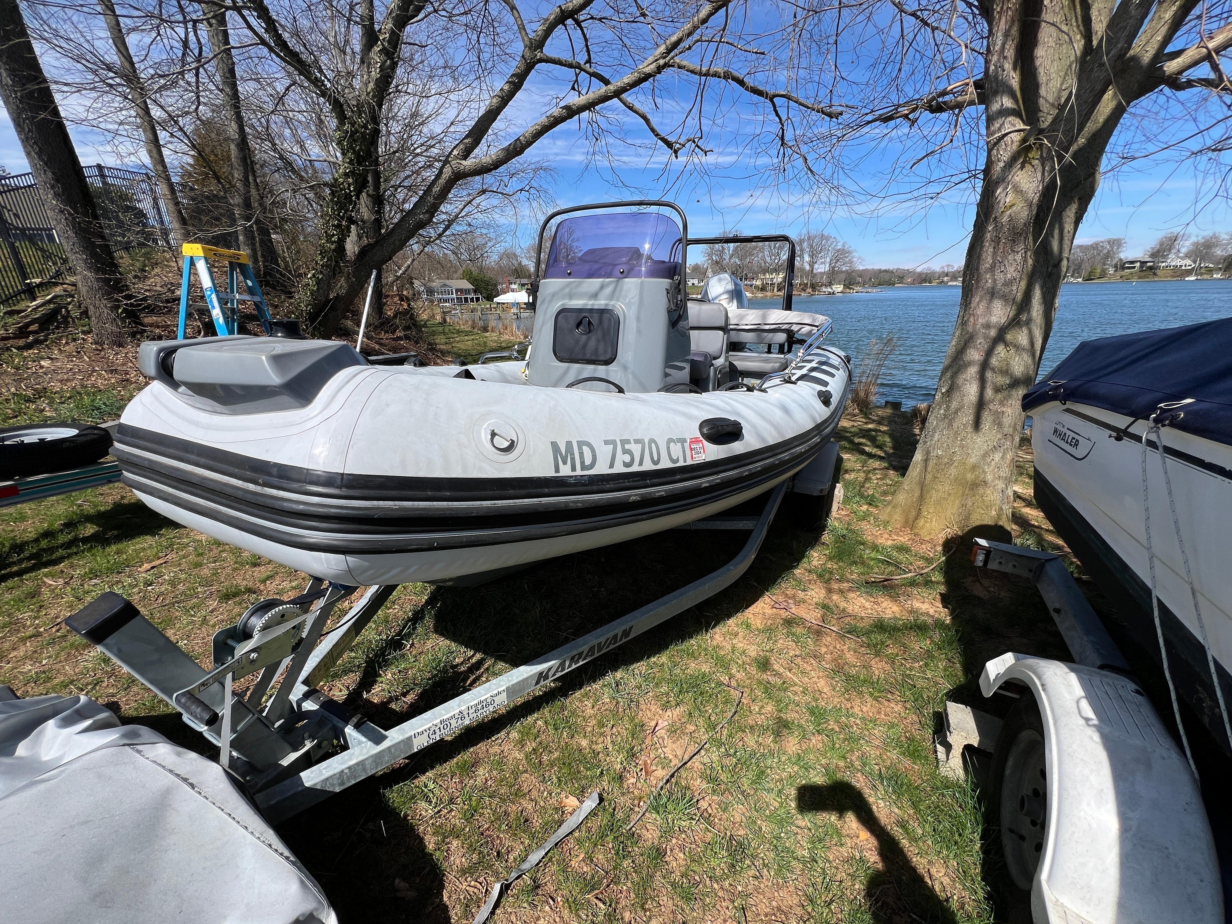 Slide: The Image of 2021 Brig Inflatables Navigator 520 boat on a trailer by a lakeside. - 22