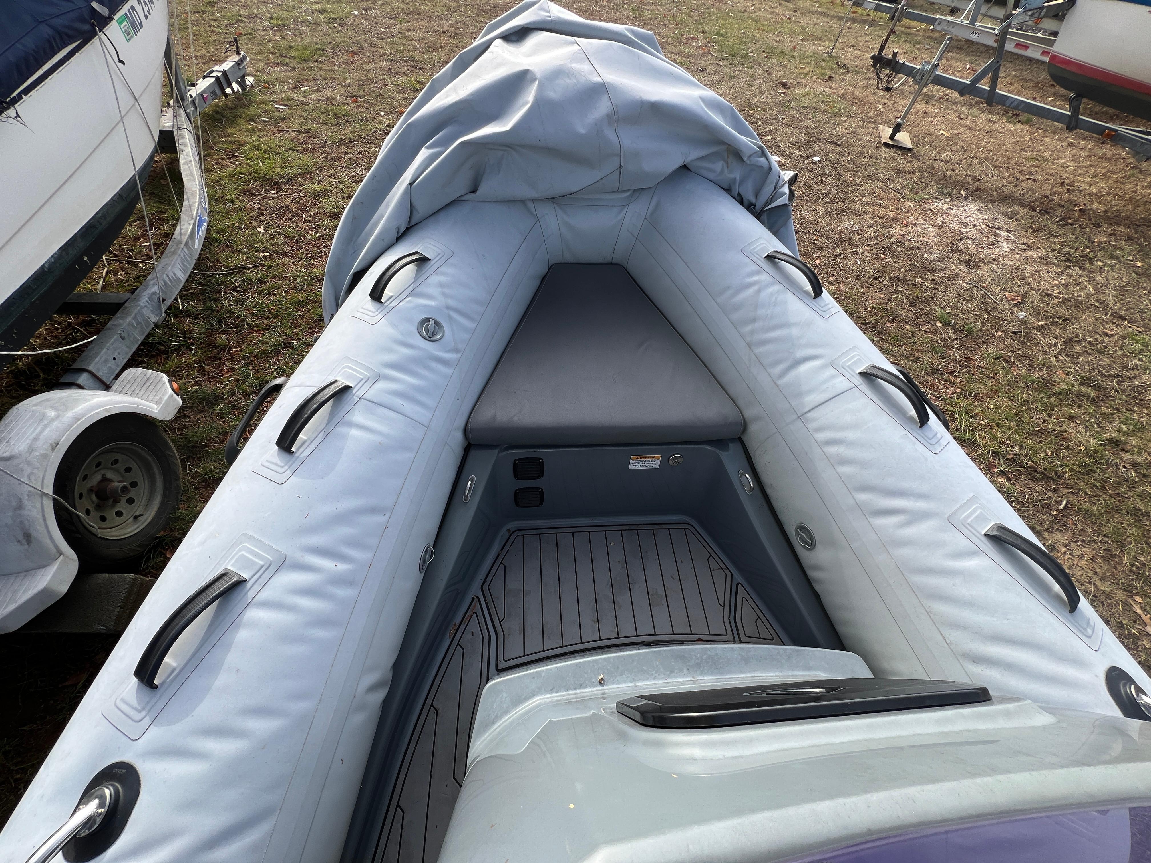Slide: The Image of 2021 Brig Inflatables Navigator 520 boat interior with seating and handles. - 5