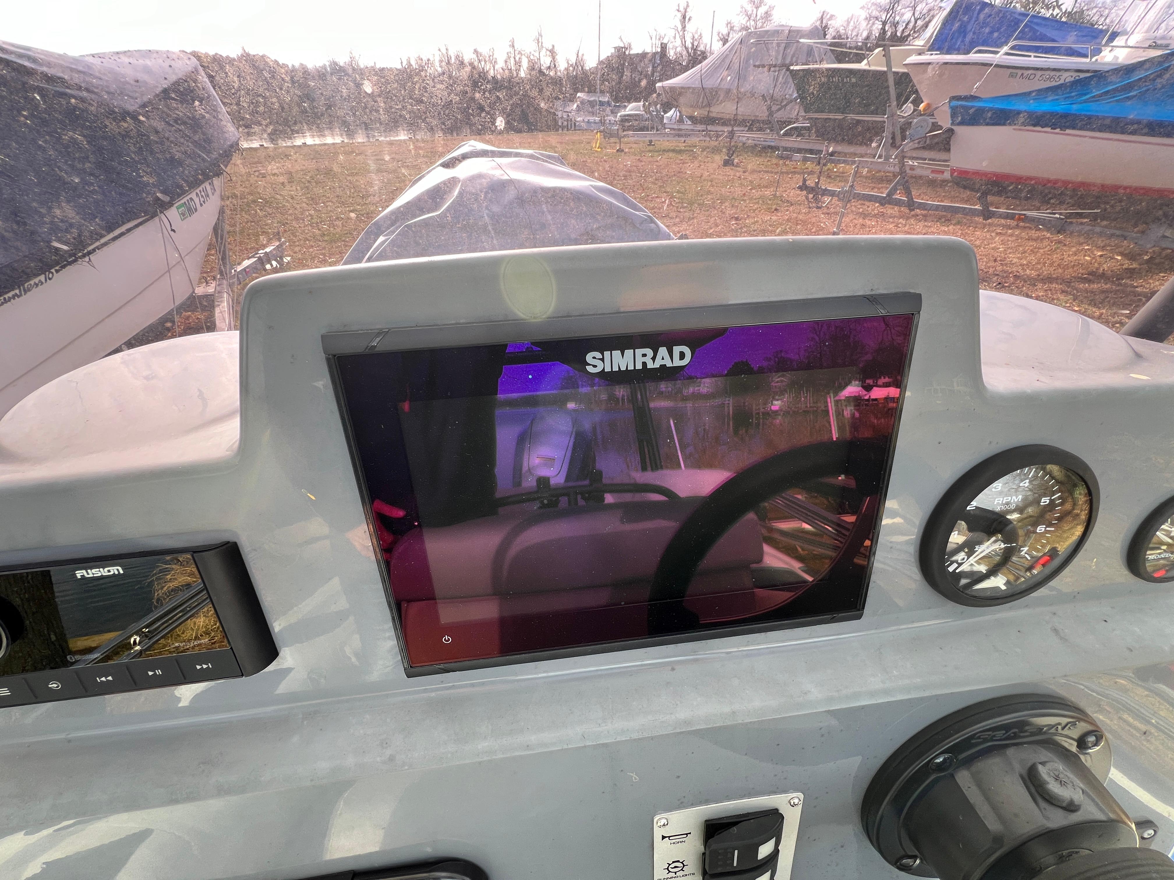 Slide: The Image of Control panel of a 2021 Brig Inflatables Navigator 520 boat with Simrad display. - 8