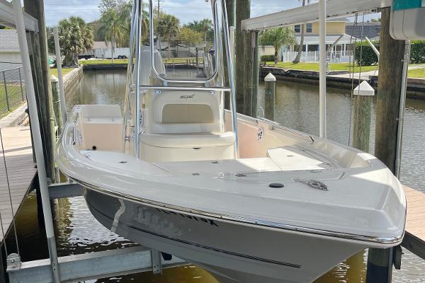 Slide: The Image of 2021 Bulls Bay 2000 boat docked in a canal. - 1
