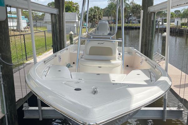 Slide: The Image of 2021 Bulls Bay 2000 boat docked in a marina. - 2